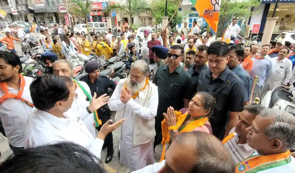Former Home Minister Anil Vij and BJP candidate Banto Katariya during door to door election campaign.